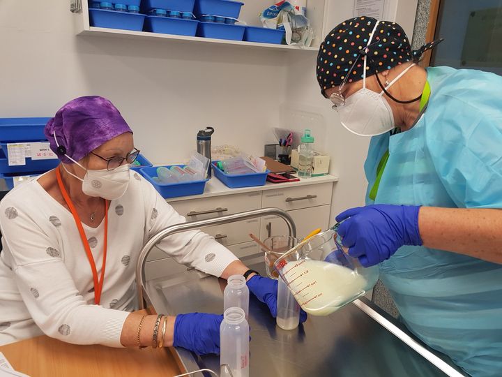 Volunteers processing donated breast milk.jpg